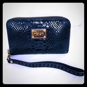 Michael Kors wristlet in black and gold